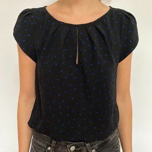 Black shirt blue polka dots